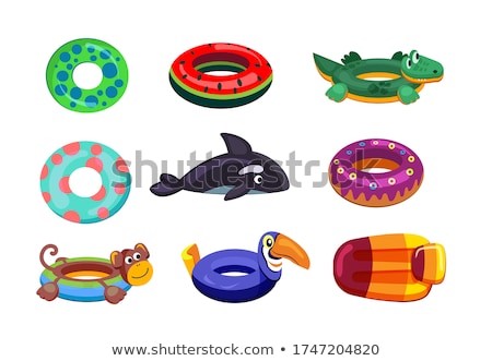 Foto stock: Monkey And Inflatables Mattress On The Beach