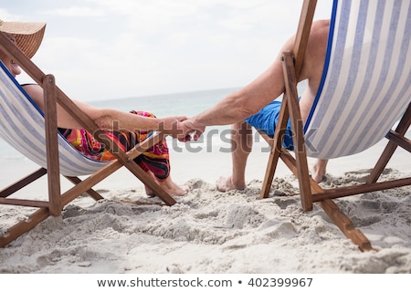 [[stock_photo]]: Couple On Deckchairs