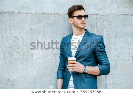 Foto stock: Portrait Of Cool Young Man Wearing Sunglasses