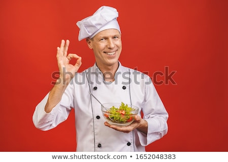 Сток-фото: Cheerful Handsome Young Chef Man Standing Isolated Over White Wall Background Holding Plate