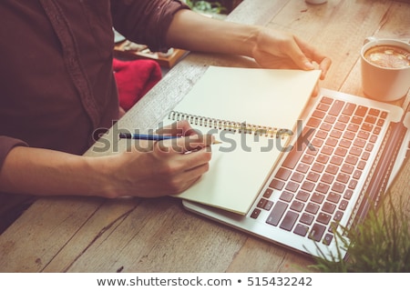 Foto stock: Man Writing In A Notebook