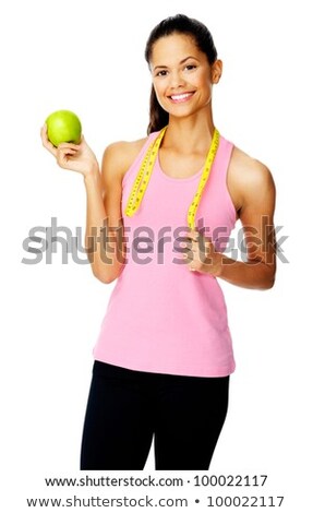 Foto d'archivio: Cute Young Woman Holding Apple And Measuring Tape