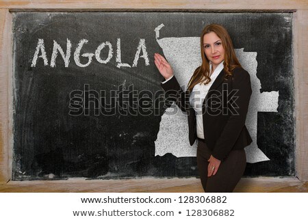 Teacher Showing Map Of Angola On Blackboard [[stock_photo]] © vepar5