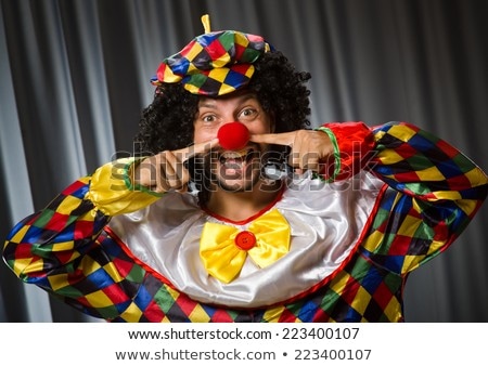 Funny Clown In Humorous Concept Against Curtain Stock fotó © Elnur