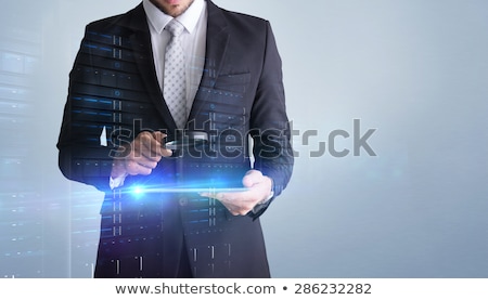 Imagine de stoc: Digitally Generated Image Of Business Professional Looking At The Blackboard