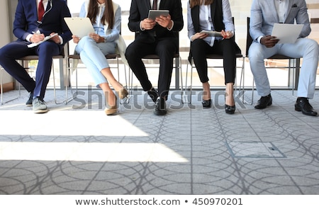Stok fotoğraf: Young Businesspeople Sitting At Interview