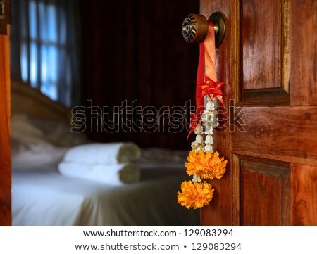 Traditional Thai Bouquet Hanging On Wooden Door Foto stock © luckyraccoon