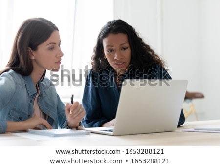 Stock photo: 2 Women Discussing Project