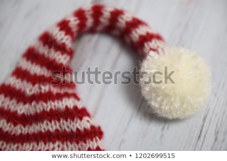 Stockfoto: Winter Holidays Knitted Red Hat With White Pom Pom