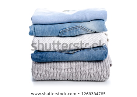 Stock photo: Stack Of Jeans Trousers Isolated On White Background