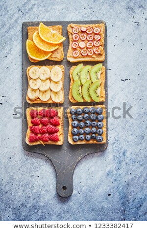 Stock photo: Wholegrain Bread Slices With Peanut Butter And Various Fruits