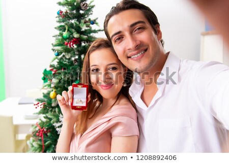 ストックフォト: Man Making Marriage Proposal At Christmas Day