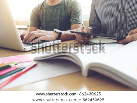 High School Or College Student Group Catching Up Workbook And Le Zdjęcia stock © Freedomz