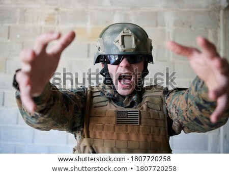 Portrait Of Soldier In Helmet Targeting [[stock_photo]] © dotshock