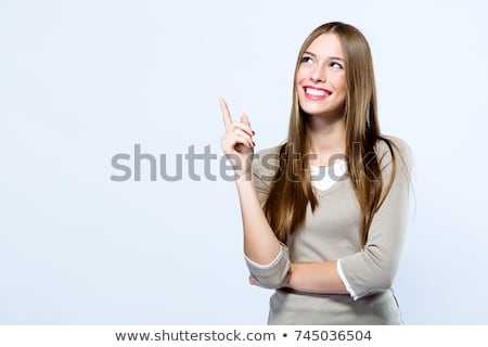 [[stock_photo]]: Woman Pointing With Finger Upward