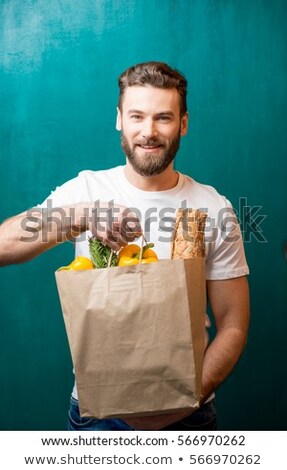 Stock photo: Man With Paper Bag Full Of Vegetables