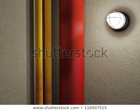 Stok fotoğraf: Three Old Rusty Pipes In A Cellar