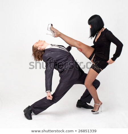 Young Woman Kicks Man In Business Suit Foto d'archivio © StepStock