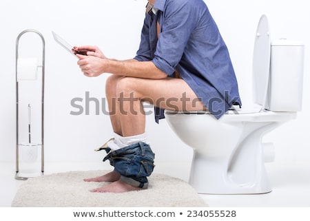[[stock_photo]]: Man In Toilet Using Laptop
