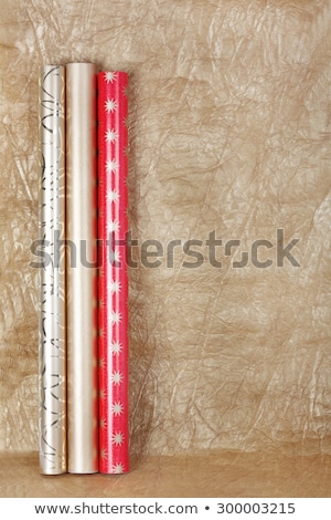 Stok fotoğraf: Rolls Of Multicolored Wrapping Paper With Streamer For Gifts On