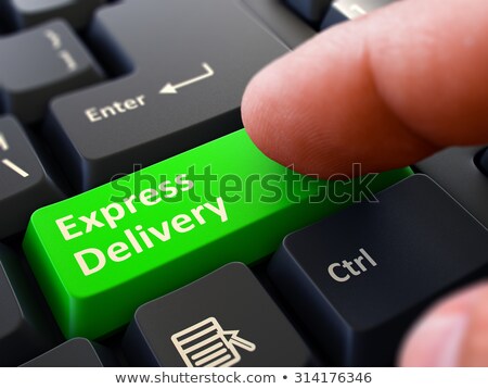 Сток-фото: Finger Presses Green Keyboard Button Express Delivery