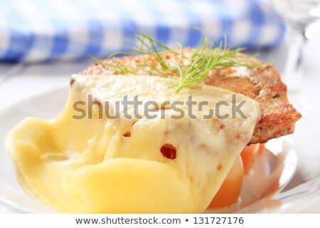 [[stock_photo]]: Marinated Pork Topped With Swiss Cheese