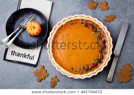[[stock_photo]]: Pumpkin Pie Tart Made For Thanksgiving Day In A Baking Dish Grey Stone Background