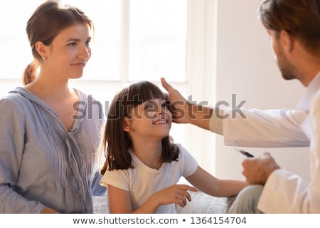 Stock photo: Mom Gently Stroking The Babys Head