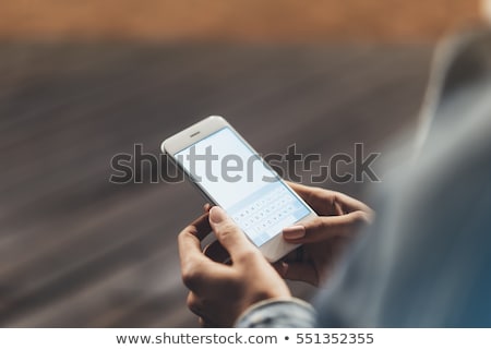Foto stock: Hand With Mobile Phone Texting