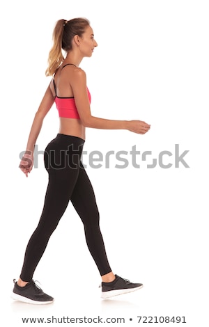 Сток-фото: Side View Of A Thin Fitness Young Woman Walking