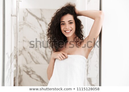 Stock fotó: Portrait Of A Satisfied Woman With Dark Curly Hair