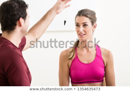 Foto stock: Male Instructor Hypnotizing Female