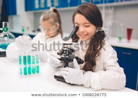 [[stock_photo]]: Two Girls Studying Chemistry At School Laboratory