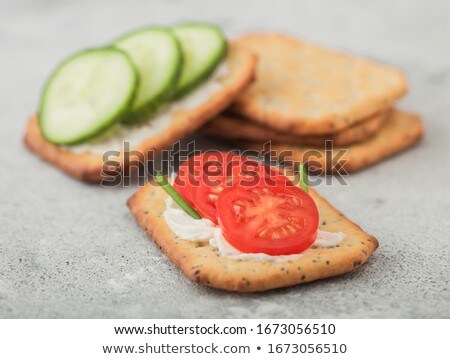 Foto d'archivio: Various Healthy Crackers With Cream And Tomato With Cucumber On Light Kitchen Table Background Macr