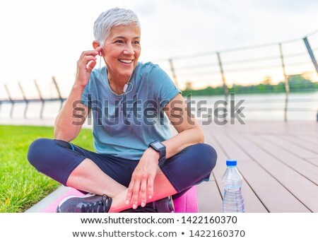 Foto stock: Happy Senior Lady Relaxing After Training