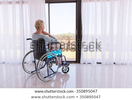 Foto d'archivio: Woman Thinking In Wheelchair