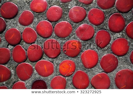 Foto d'archivio: Cobble Stones Brick Walkways Background In Red And Grey
