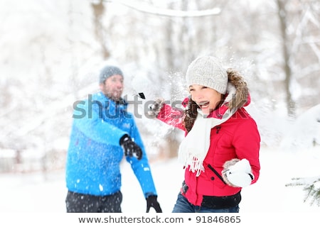 Woman Has Fun In Winter Throws Snow Stok fotoğraf © Maridav