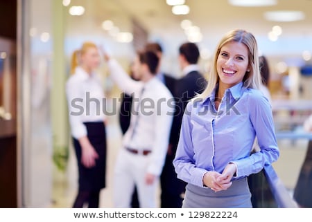 Business Woman With Her Staff In Background At Office [[stock_photo]] © dotshock