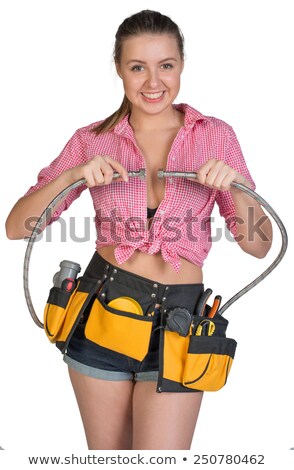 Plumber In Shorts Shirt Tool Belt With Tools Holding Flexible Hose And Wrench Stockfoto © cherezoff