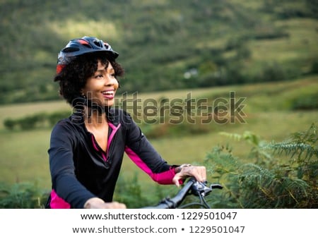 Zdjęcia stock: Afro American Woman Riding On Bike Mountain View