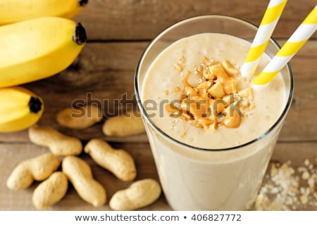 Сток-фото: Banana Smoothies And Bananas On An Old Wooden Background