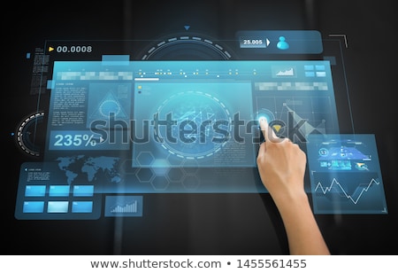 Zdjęcia stock: Hand Using Black Interactive Panel With Charts