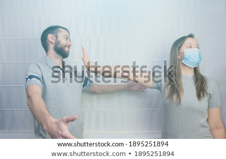 Stock foto: Woman With Open Palm Hand In Front Of City