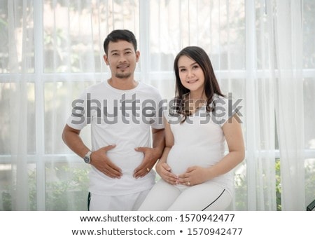 Stok fotoğraf: Pregnant Woman And Her Husband