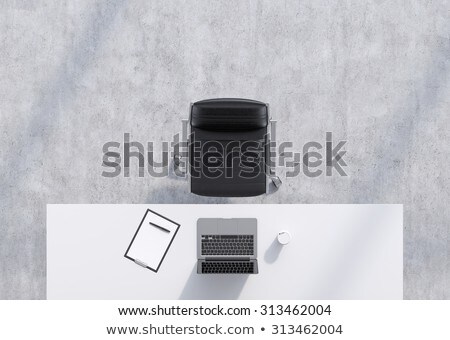 Сток-фото: Office Table With Laptop And Black Paper Sheet 3d Rendering