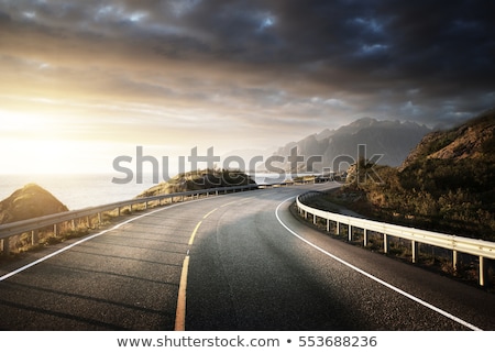 Stockfoto: Coast Of Norwegian Sea On Rocky Coast In Fjord On Sunset