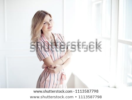 Foto d'archivio: Happy Beautiful Woman Staring Out The Window