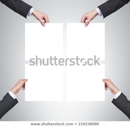 Stock photo: Businessman Is Holding Board With Question Signs