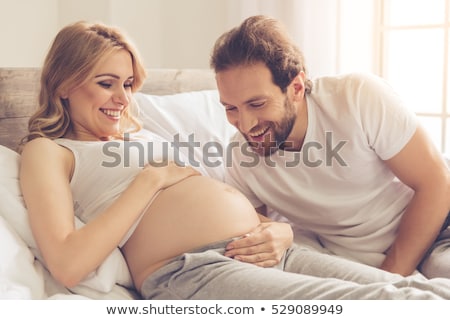 Stok fotoğraf: Beautiful Pregnant Woman Talking With Mother